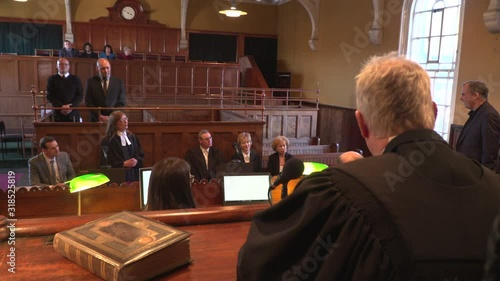 4K: Court / Courtroom trial taking place. Witness is being questioned. Wide Shot from behind the Judge. 