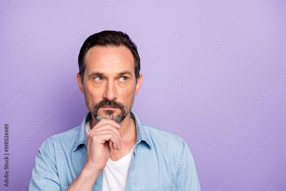 Close up photo of minded man feel pensive emotion think work thoughts look copyspace touch chin fingers wear stylish modern clothes isolated over violet color background Close up photo of minded man feel pensive emotion think work thoughts look copyspace touch chin fingers wear stylish modern clothes isolated over violet color background