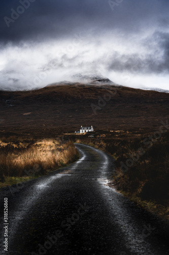 Road will guide you. Single white house in under the moody mountain top hidden in Scotland
