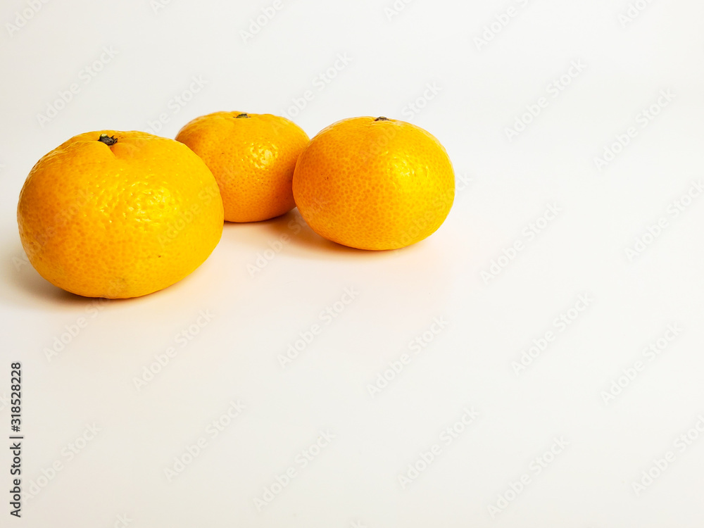 Juicy delicious tangerines isolated on a white background. Orange tangerine delicious and healthy fruit. Juicy delicious tangerines isolated on a white background. Orange tangerine delicious and healthy fruit.