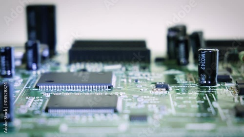 Close-up sliding shallow depth focus video of vintage pcb, electronic parts, IC. 4k photo