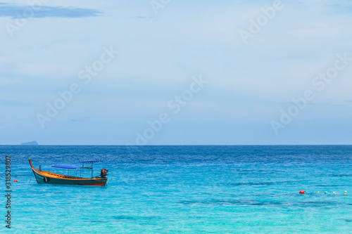 The tour boat is waiting for tourists at sea. at the Similan Islands, Phang Nga, Thailand