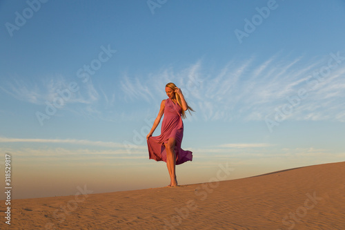 Blonde model in the desert at Emirates