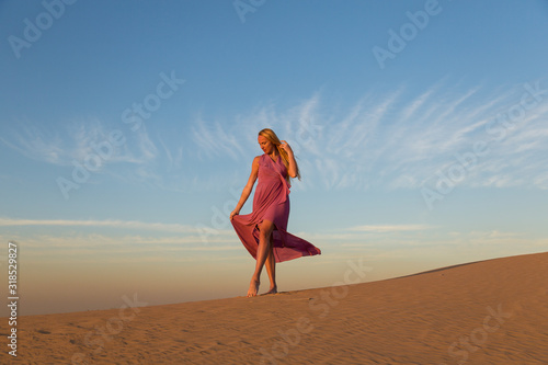 Blonde model in the desert at Emirates
