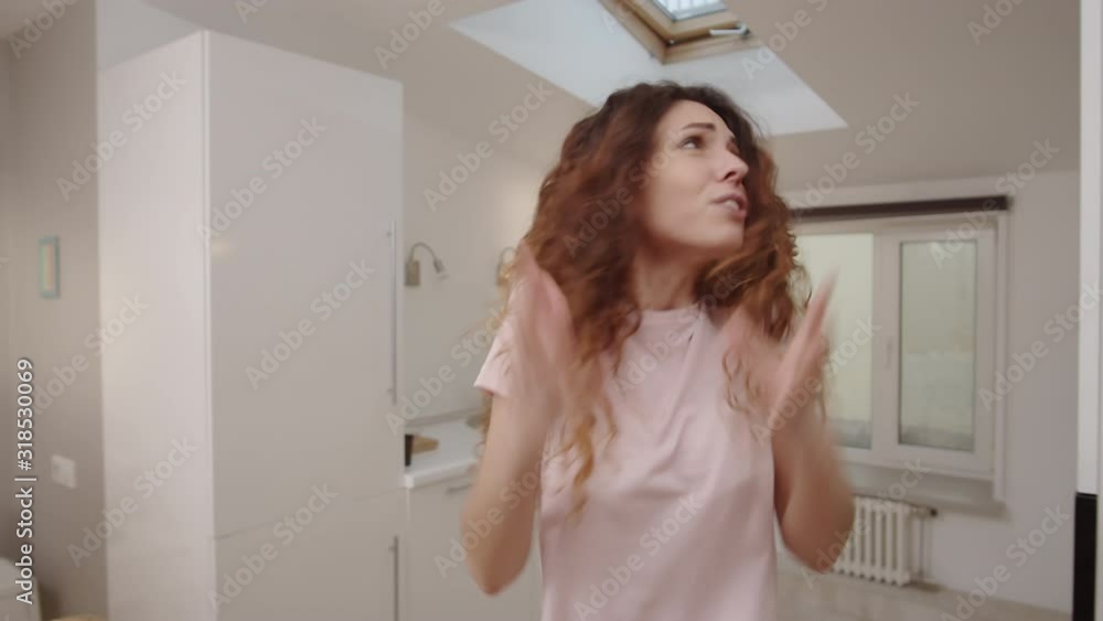 POV medium shot of unhappy resentful young Caucasian woman arguing with unhelpful husband at home, nagging, screaming, shouting and gesticulating expressively POV medium shot of unhappy resentful young Caucasian woman arguing with unhelpful husband at home, nagging, screaming, shouting and gesticulating expressively