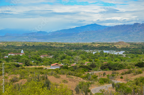 panoramic view of a village by a river photo