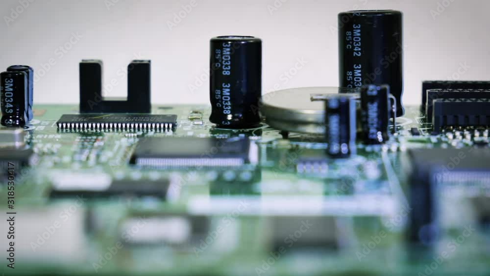 Close-up sliding video of printed circuit board - cap[acitors, resistors. 4k Close-up sliding video of printed circuit board - cap[acitors, resistors. 4k