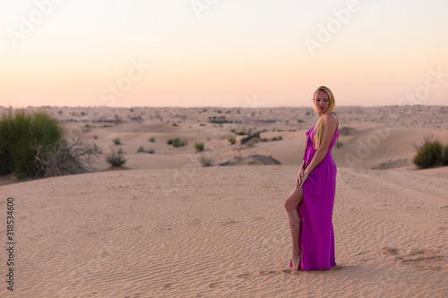 Blonde model in the desert in Emirates