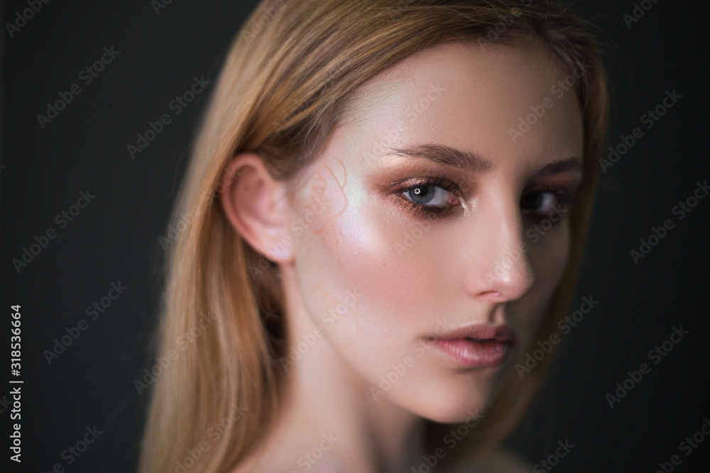 Studio portrait of a model. Body art gray roses. Beautiful girl on gray background Studio portrait of a model. Body art gray roses. Beautiful girl on gray background