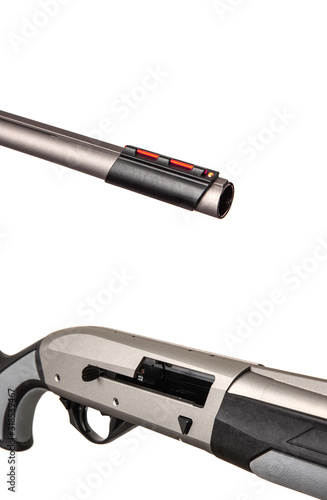 Modern black silver shotgun isolated on white background.  Weapons for sports, hunting and self-defense.