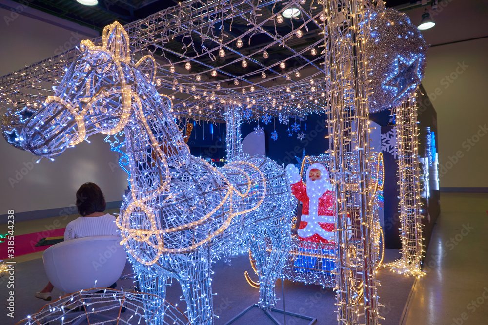 Illumination of Santa Claus in a cart on deer for Christmas