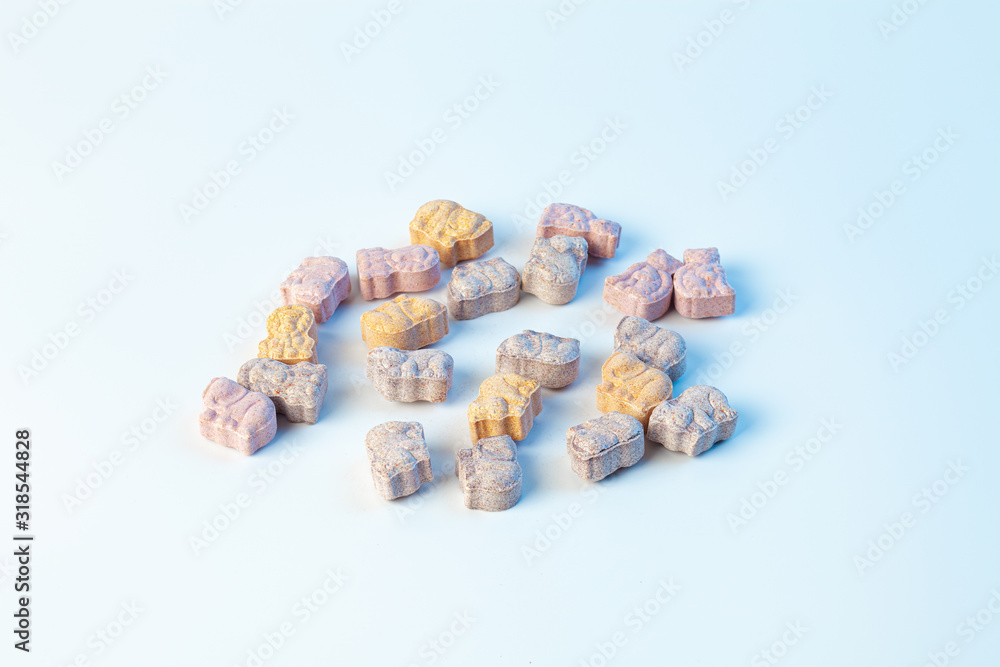 children's vitamins in the form of animals on a white background with light blue color children's vitamins in the form of animals on a white background with light blue color