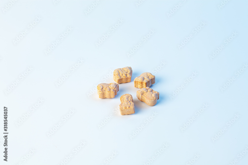 children's vitamins in the form of animals on a white background with light blue color children's vitamins in the form of animals on a white background with light blue color