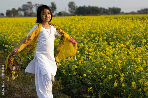 child and mustard flower
