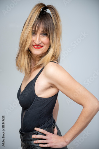 Pretty woman posing with black lingerie