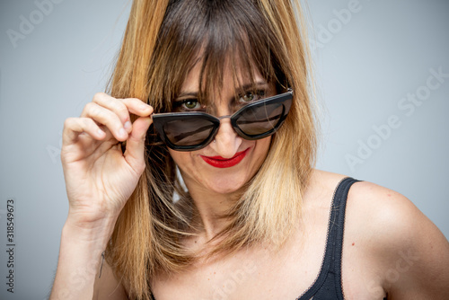 Pretty blond hair woman posing