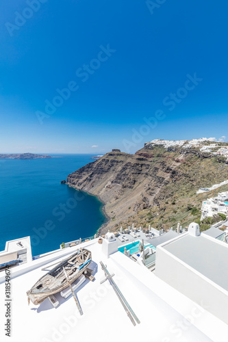 Santorini, Greece. Famous view of traditional white architecture Santorini landscape with blue sky. Summer vacations background. Luxury travel tourism concept. Amazing summer destination