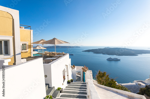 Santorini, Greece. Famous view of traditional white architecture Santorini landscape with blue sky. Summer vacations background. Luxury travel tourism concept. Amazing summer destination