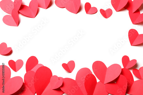 Cut out of red paper hearts on white background isolated.