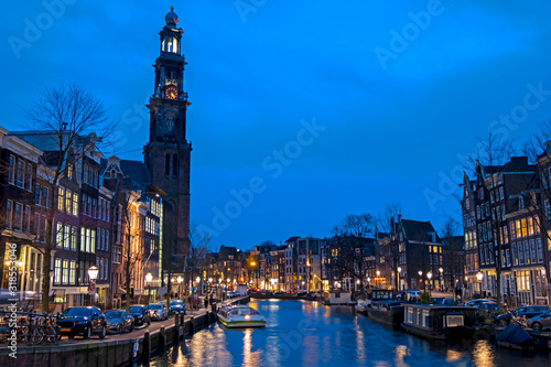 City scenic from Amsterdam with the Westerkerk in the Netherlands at sunset