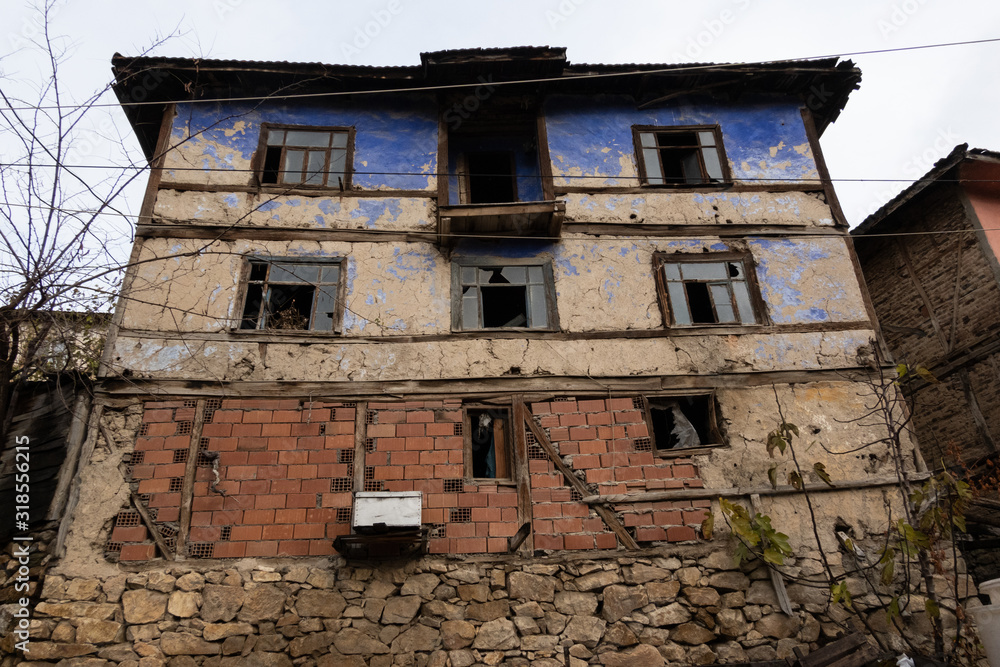 abandoned mud brick house in the village of Sansarak, Turkey