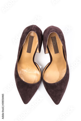 Stylish classic suede women's leather shoes with medium high heels on an isolated white background. Shoe sale / clearance concept announcement.