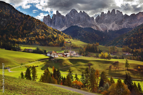 Famous best alpine place of the world .Santa Maddalena village with Dolomites mountains in background  Val di Funes valley  Trentino Alto Adige region  Italy  Europe