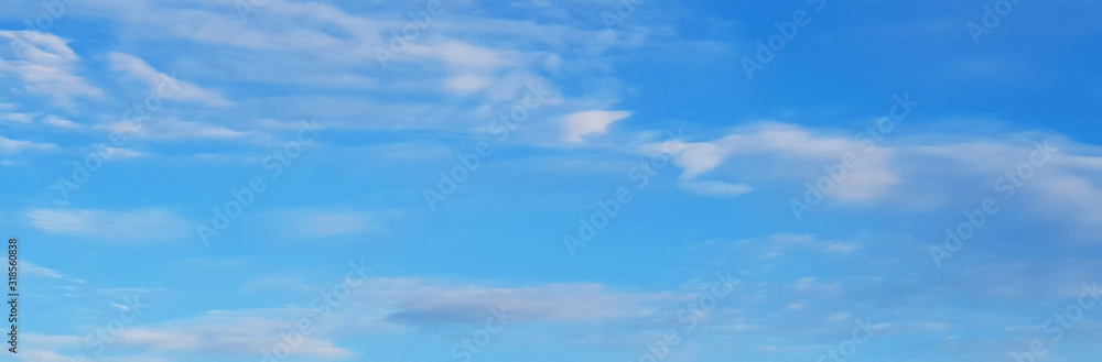 ิblue sky with white clouds, beautiful natural background Bright color sky with sunshine and fresh air on vacation.