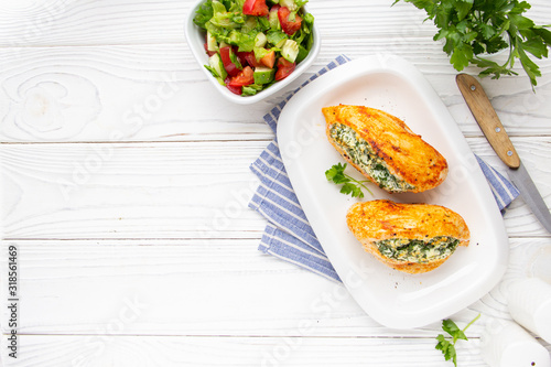 Chicken fillet stuffed with cottage cheese (ricotta, feta) and herbs (parsley, spinach, dill). Delicious homemade food, healthy
