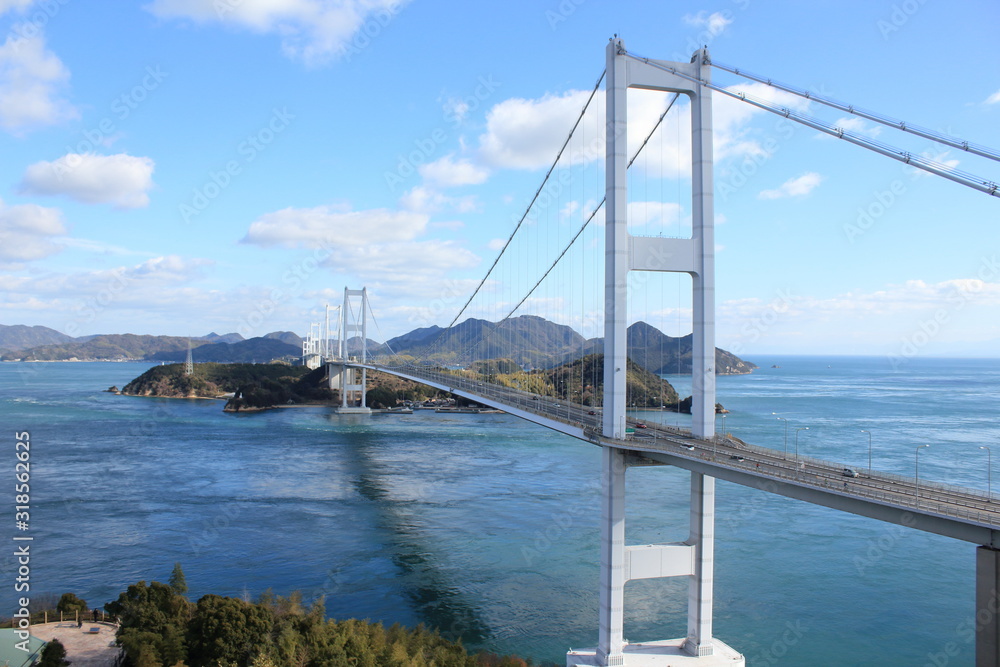 Stylish bridge across on the blue beautiful ocean in Japan Stylish bridge across on the blue beautiful ocean in Japan