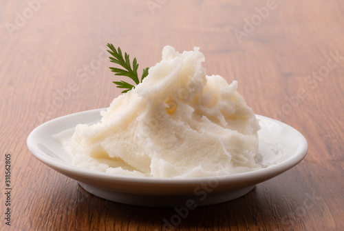 small plate of lard on wooden table photo