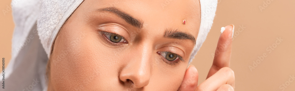 panoramic shot of girl with treatment cream on finger isolated on beige panoramic shot of girl with treatment cream on finger isolated on beige