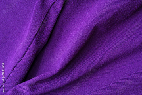 Fragment of crumpled violet polyester wear