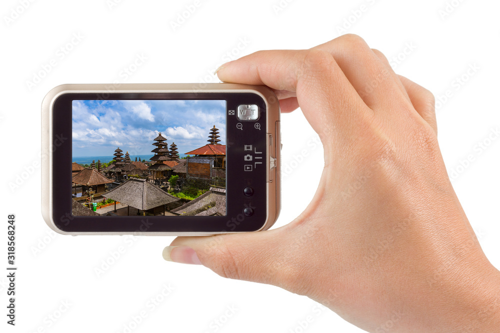 Hand with camera and Besakih temple in Bali Indonesia (my photo) Hand with camera and Besakih temple in Bali Indonesia (my photo)