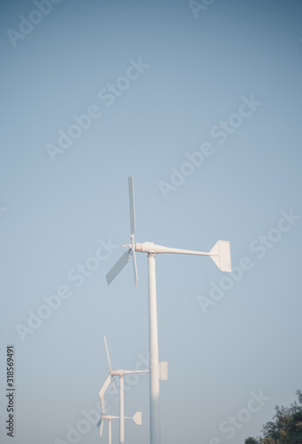 wind turbine against blue sky.