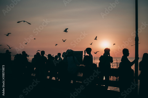 Silhouette of the sea on sunset background of the sky
