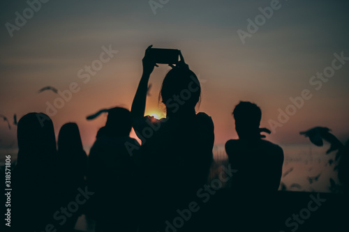 Silhouette of the sea on sunset background of the sky