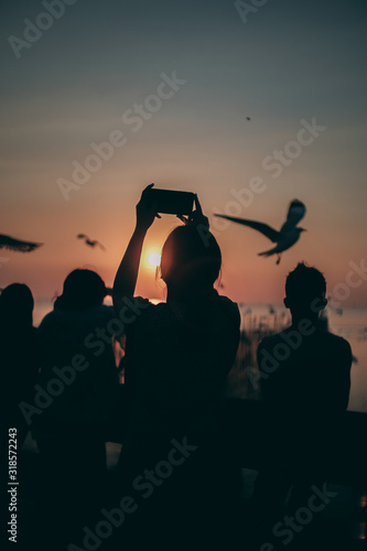 Silhouette of the sea on sunset background of the sky