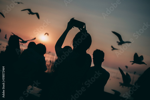 Silhouette of the sea on sunset background of the sky