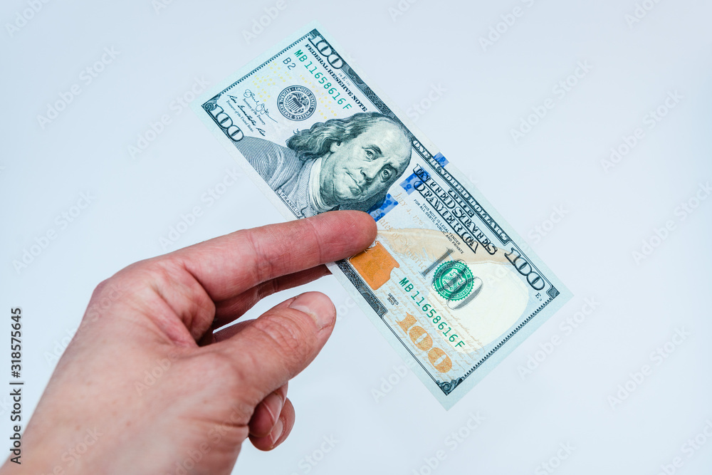 Hand and dollars isolated on white backgrounds Hand and dollars isolated on white backgrounds