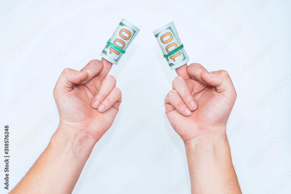 Two hands and dollars isolated on white backgrounds Two hands and dollars isolated on white backgrounds
