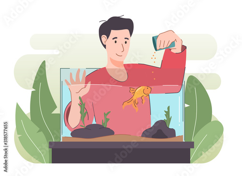 Man feeding fish. Goldfish in aquarium. Happy people with pet