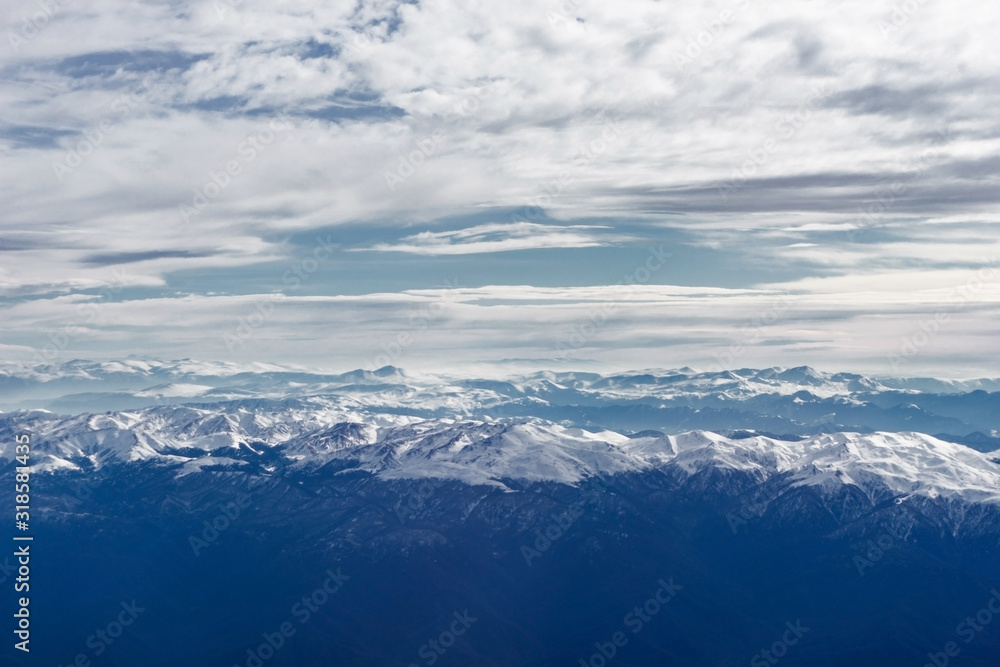 Caucasus mountains. Flight to Kutaisi. Beautiful mountain top view seen from airplane.