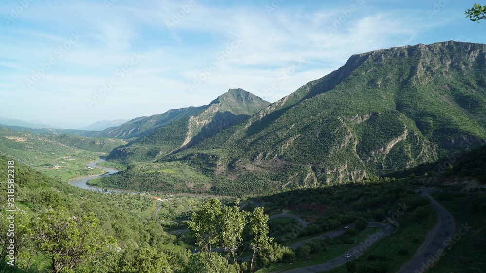 A scenery of The northern Iraq ( Iraqi Kurdistan region)'s nature valley river and mountains in spring time