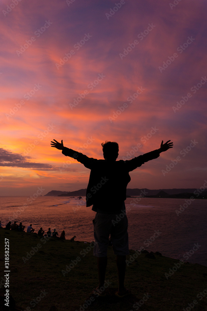 silhouette of Happy man at sunset