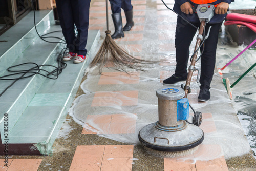 cleaning the floor with polishing machine