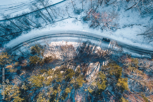 Fototapeta Naklejka Na Ścianę i Meble -  Aerial view of snowy road, Lithuania