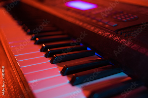 Wallpaper Mural Synthesizer keys in neon light. Piano buttons in the dark Torontodigital.ca