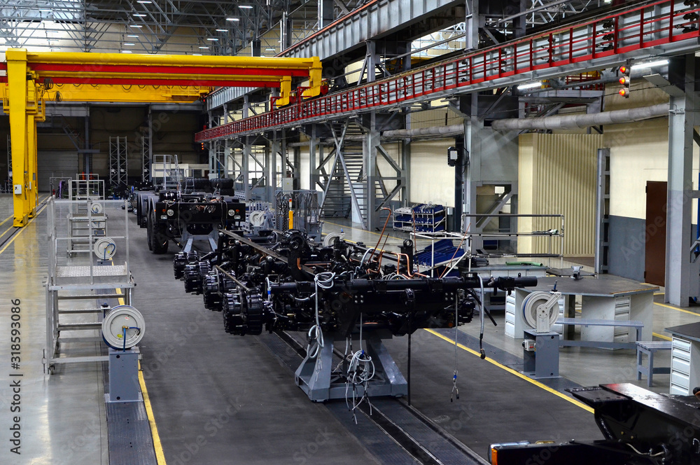 Obraz na płótnie MINSK, BELARUS. JUL 27, 2019: Inside of the Minsk Wheel Tractor Plant VOLAT. Industrial workshop and assembly line for the production of commecical and military trucks, wheel chassis and vehicles w salonie