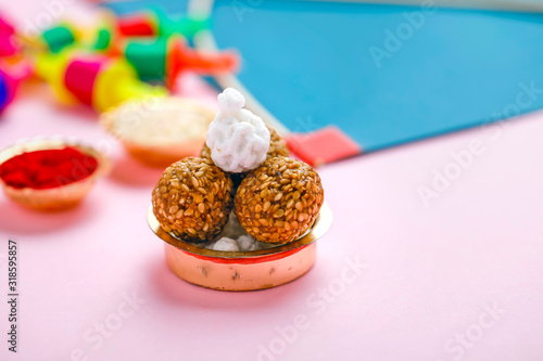 Indian festival makar sankranti concept, Sesame seed ball or til ke laddo, tilgul and Kite String  photo